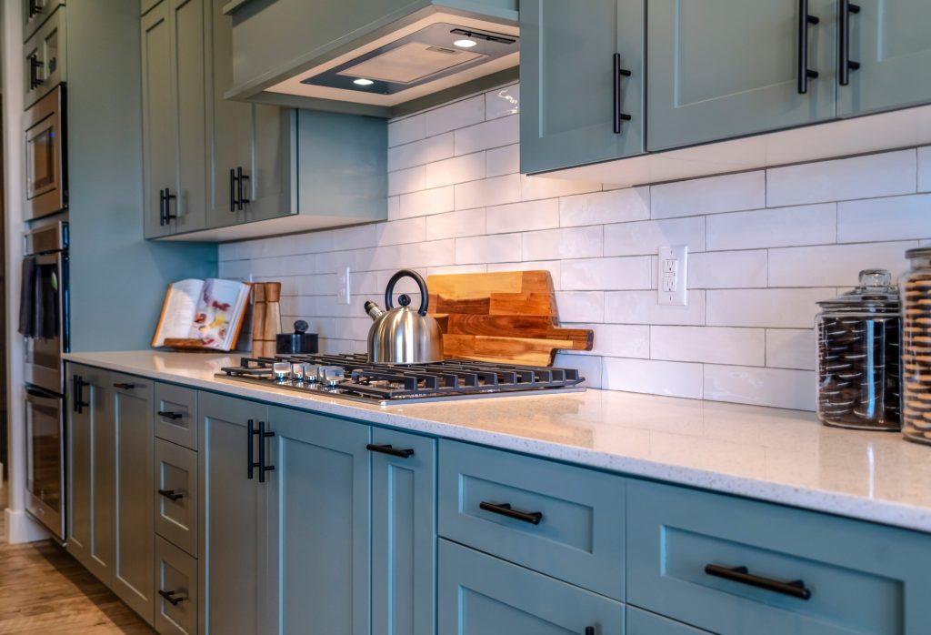 Blue Green Kitchen Cabinets with Black Hardware