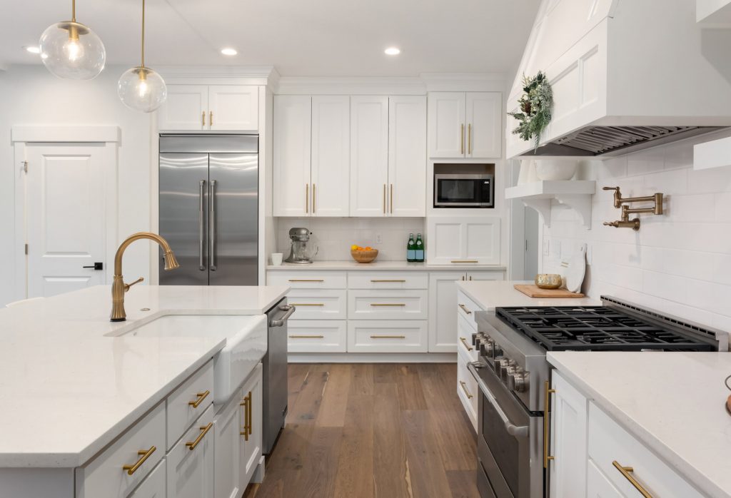White Kitchen Cabinets with Gold Hardware Accents